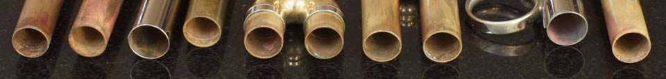 Flushmute - The revolutionary trumpet cleaning system from Spencer Trumpets. Image showing slides after Flushmute cleaning.