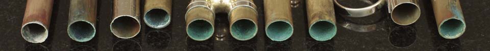Flushmute - The revolutionary trumpet cleaning system from Spencer Trumpets. Image showing slides before Flushmute cleaning.